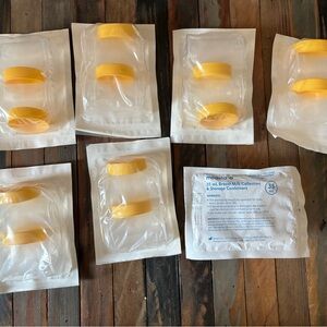 Medela Breast Milk Storage Containers with Yellow Lids